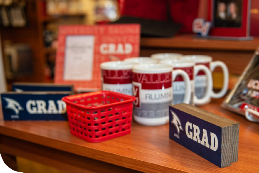 Bookstore items that say Grad and Alumni from Grad Fair